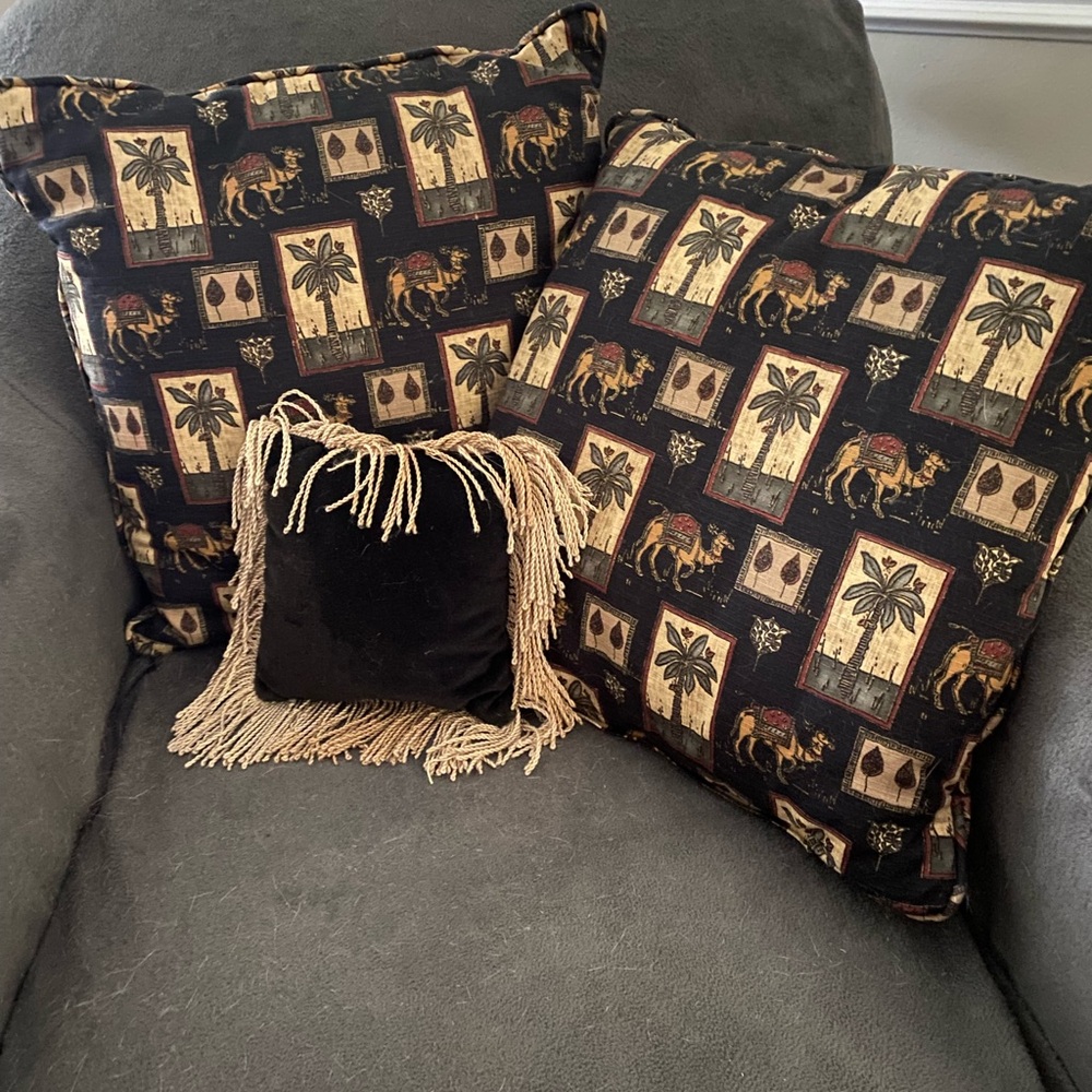 Pillows: :black w/camels/palm trees; 2nd side is black/maroon paisley;sm velvet